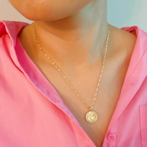 Astronomical Glam Collection gold plated constellation pendant necklace with cubic zirconia and twisted chain on display card