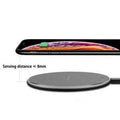 15W Fast Wireless Charger pad with a slim black metal body and textured surface, shown with charging indicator
