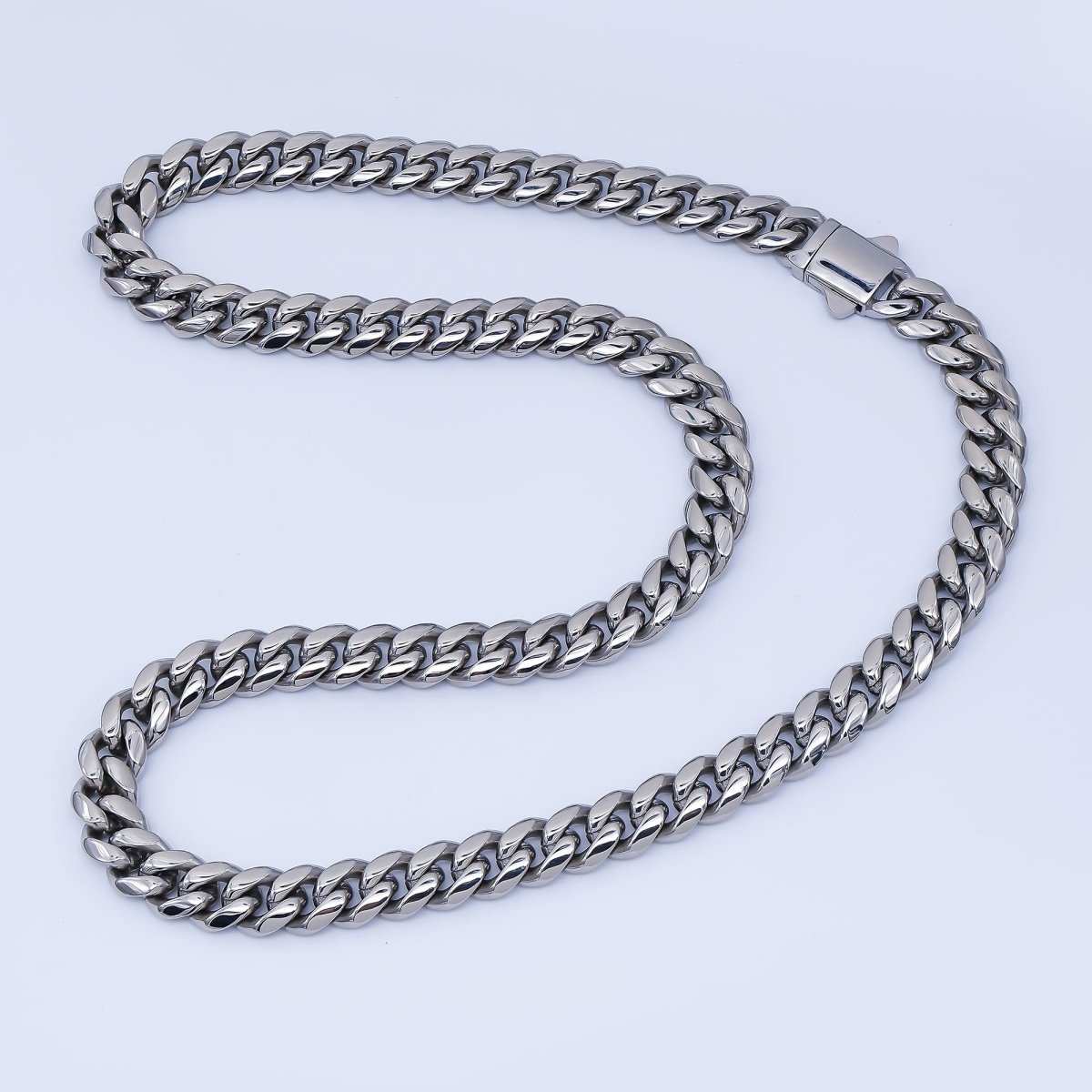 Cuban link chain necklace in Chunky Stainless Steel, with a polished silver-tone finish and thick interlocking links.